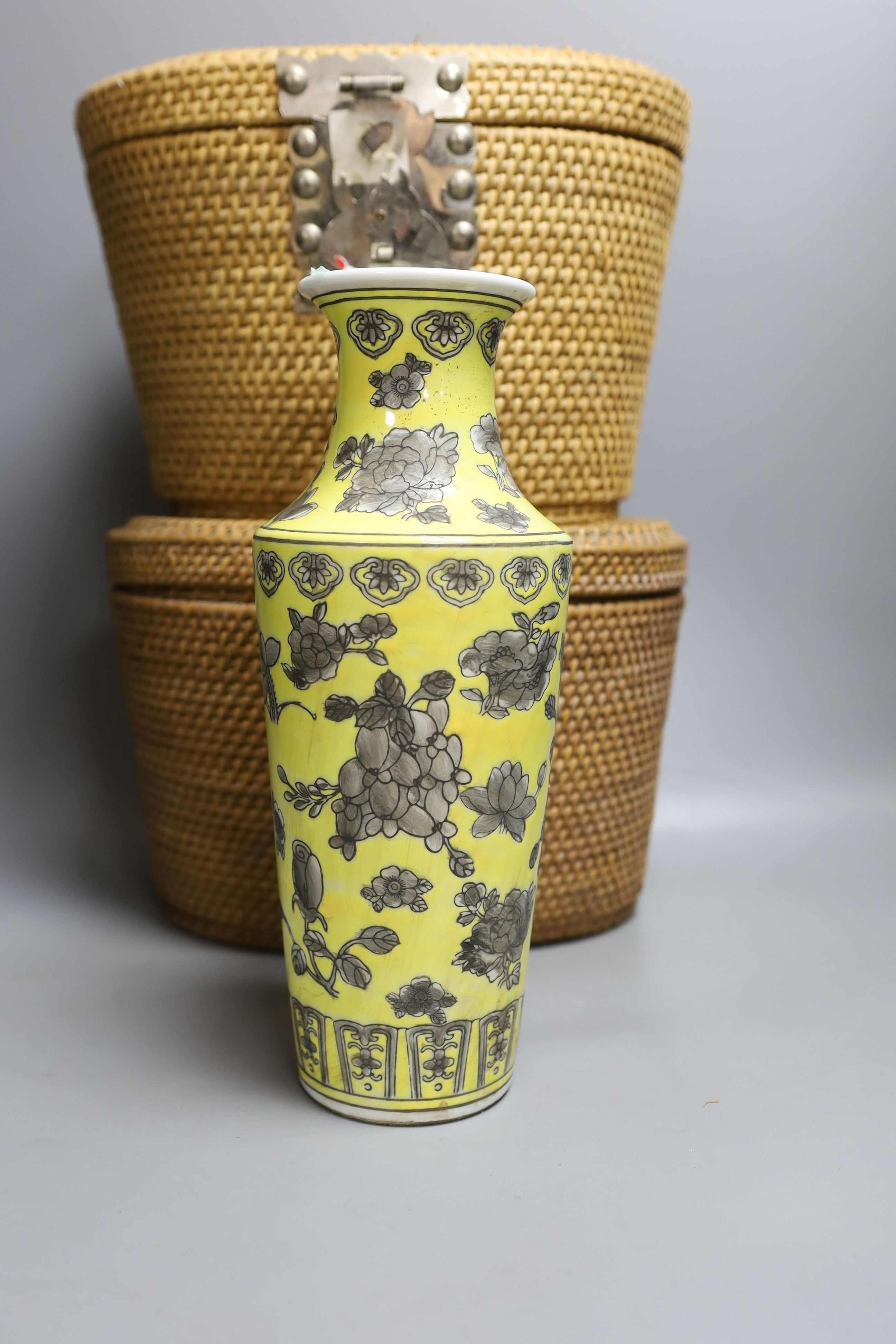 Two wicker-cased Chinese porcelain teapots together with a Chinese celadon dish and yellow vase, 28cm tall, (4)